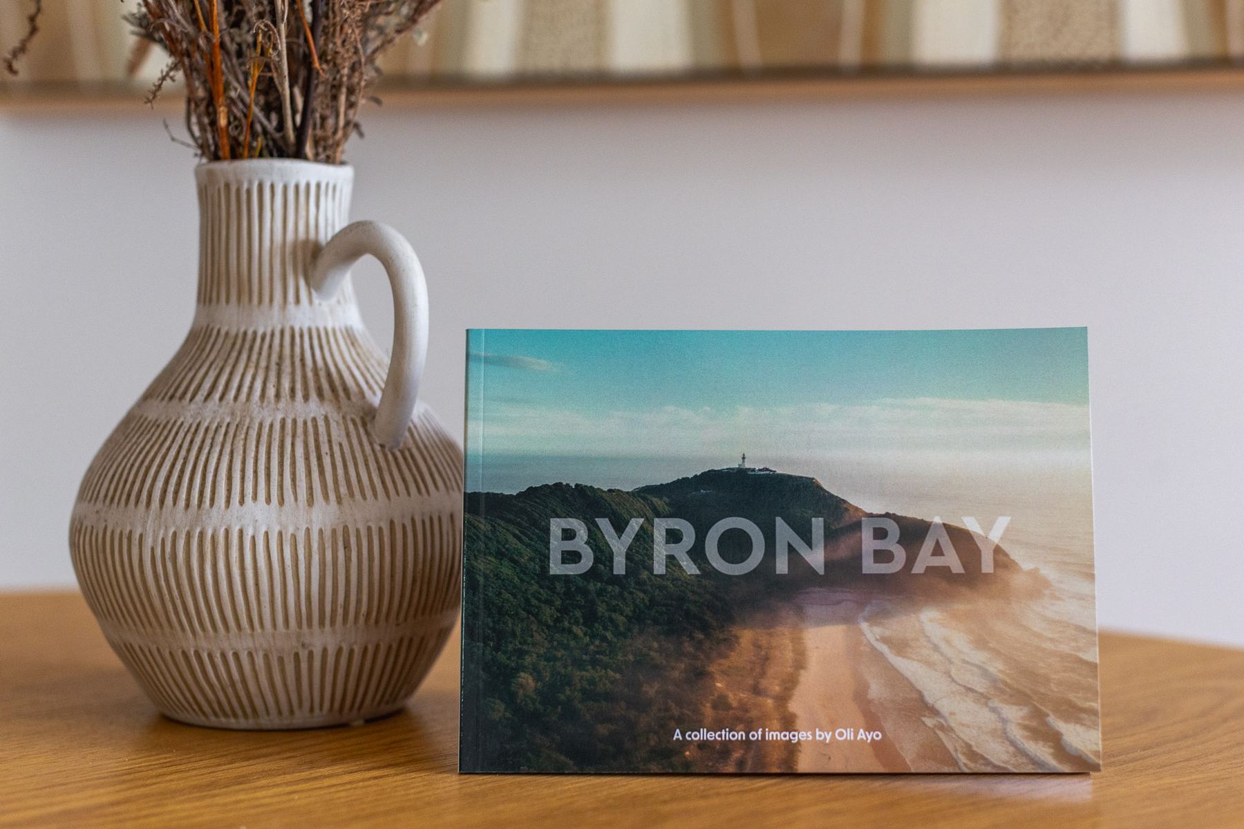 Byron Bay book — A5 landscape softcover, photographed in a styled interior